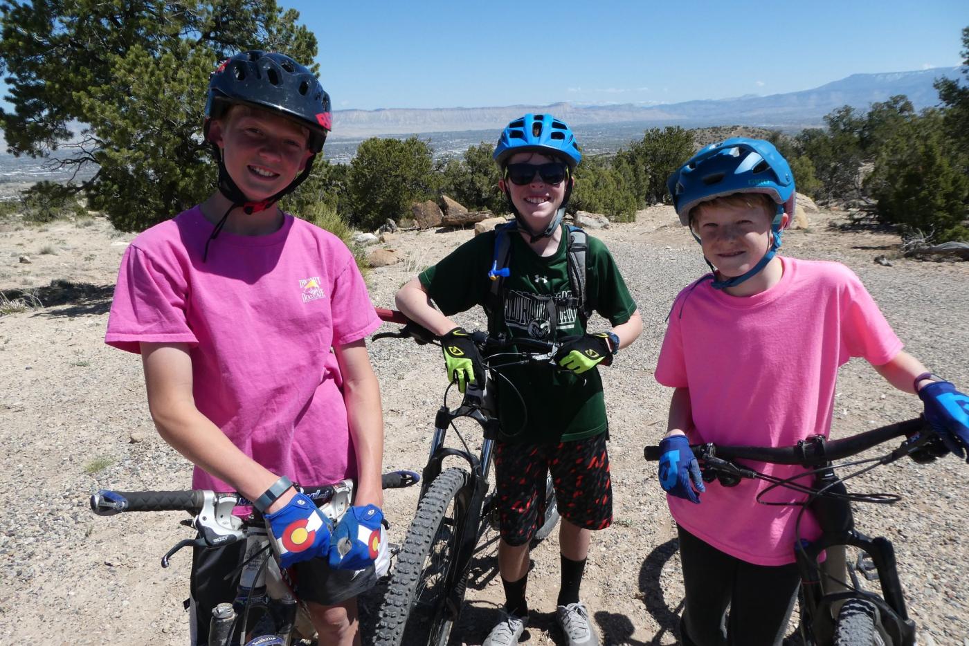 Three middle school age mountain bikers